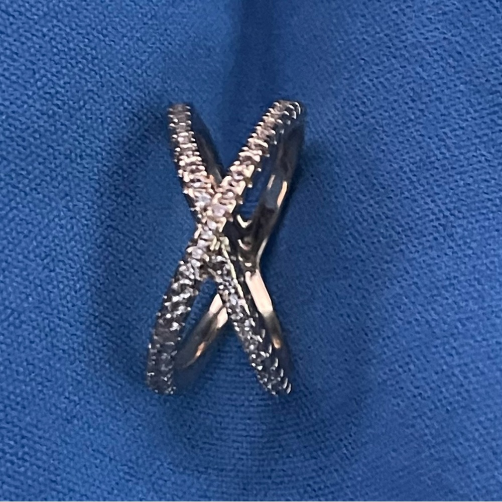 NWT  Gold plated criss cross cubic zirconia  on sides and front of ring. Sz 7